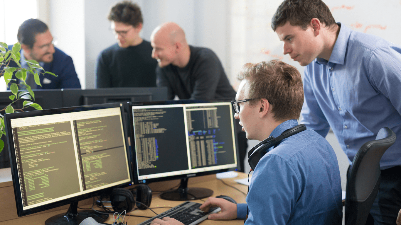 team leader in IT department guiding his personnel